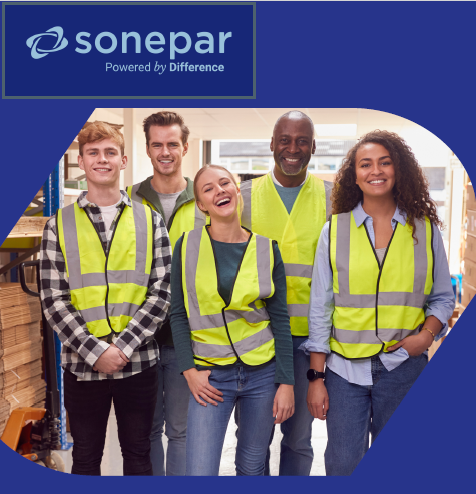 Diverse Sonepar employees wearing safety vests in a warehouse