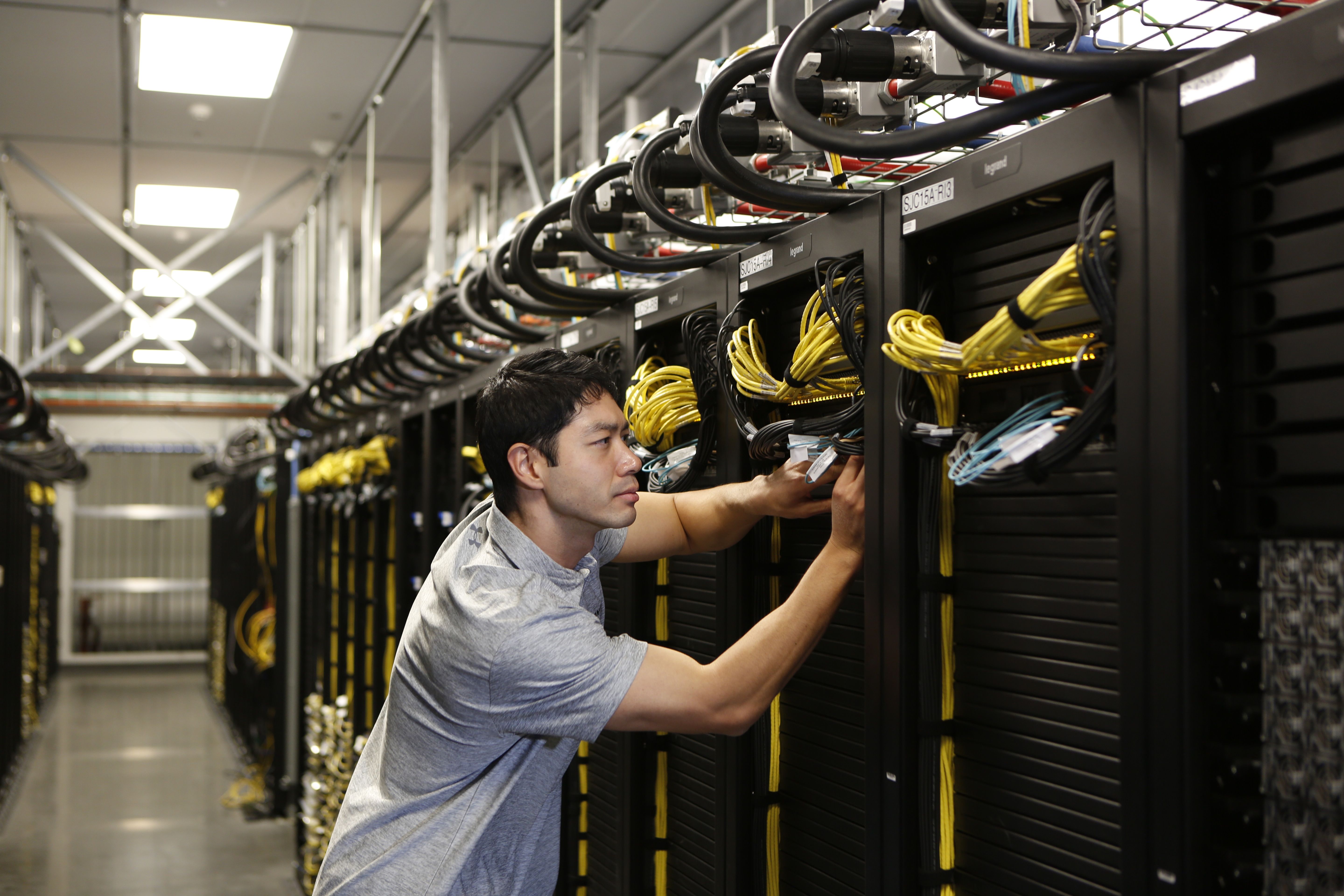 data center engineers inspecting critical infrastructure in a modern facility